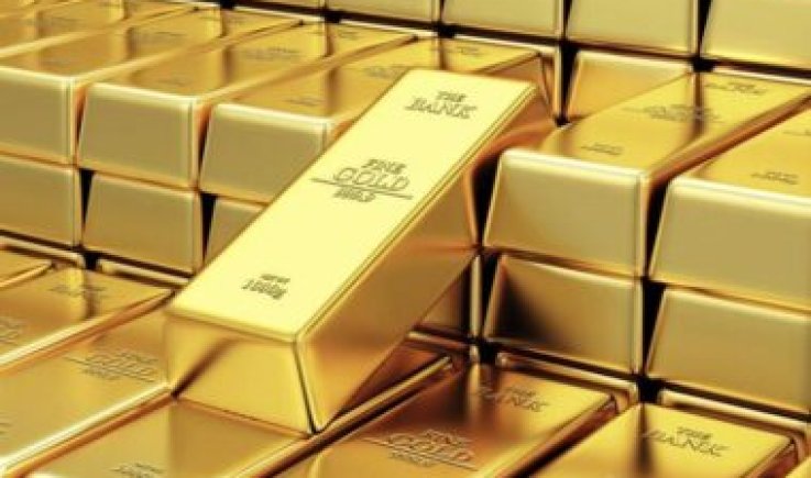 الذهب قرب أدنى مستوياته في أربعة أشهر بعد التلميح برفع الفائدة