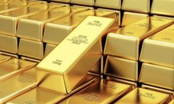 الذهب قرب أدنى مستوياته في أربعة أشهر بعد التلميح برفع الفائدة